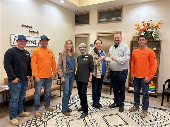 Photo of people at a check presentation jpg