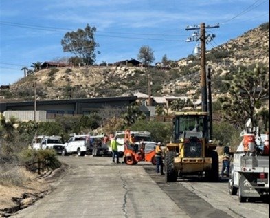 Photo of crews paving street
